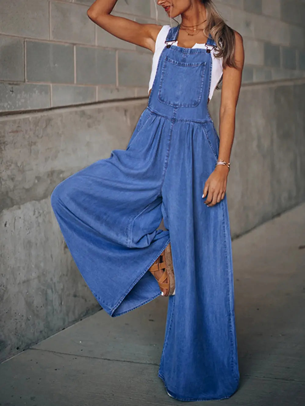 Person wearing a blue denim jumpsuit
