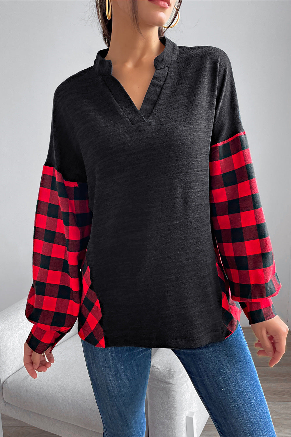 black shirt with red and black plaid sleeves